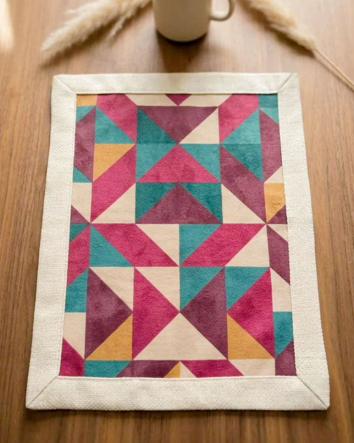 Purple geometric Mosaic placemat photographed on wooden table