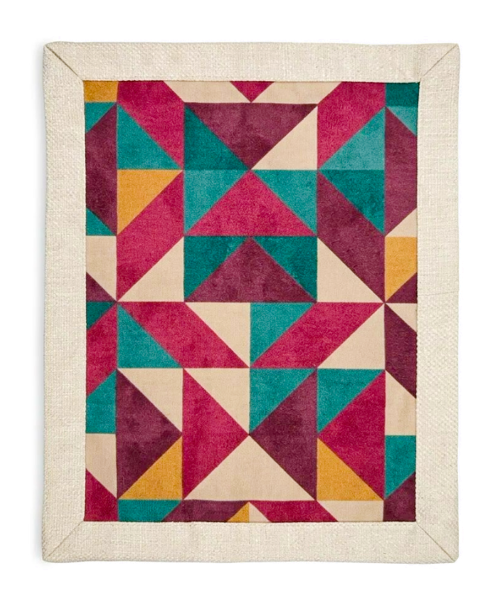 Purple geometric side of Mosaic reversible placemat laid flat
